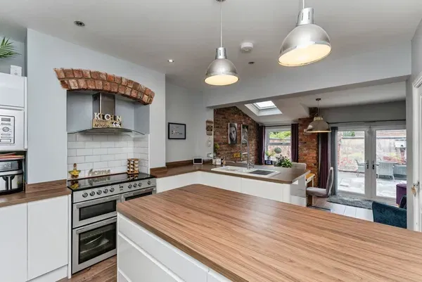 Bright, spotless open-plan kitchen in a UK home